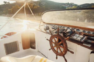 sun shines over wooden boat in the sea